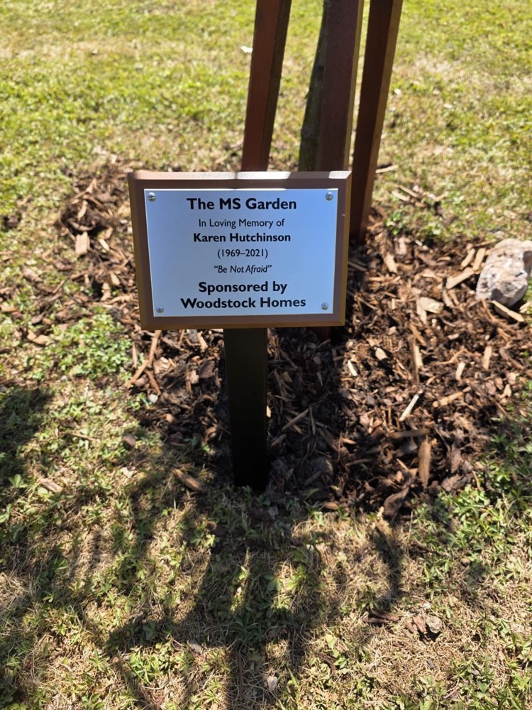 Memorial plaque reading The MS Garden, In Loving Memory of Karen Hutchinson, at The Brightwell